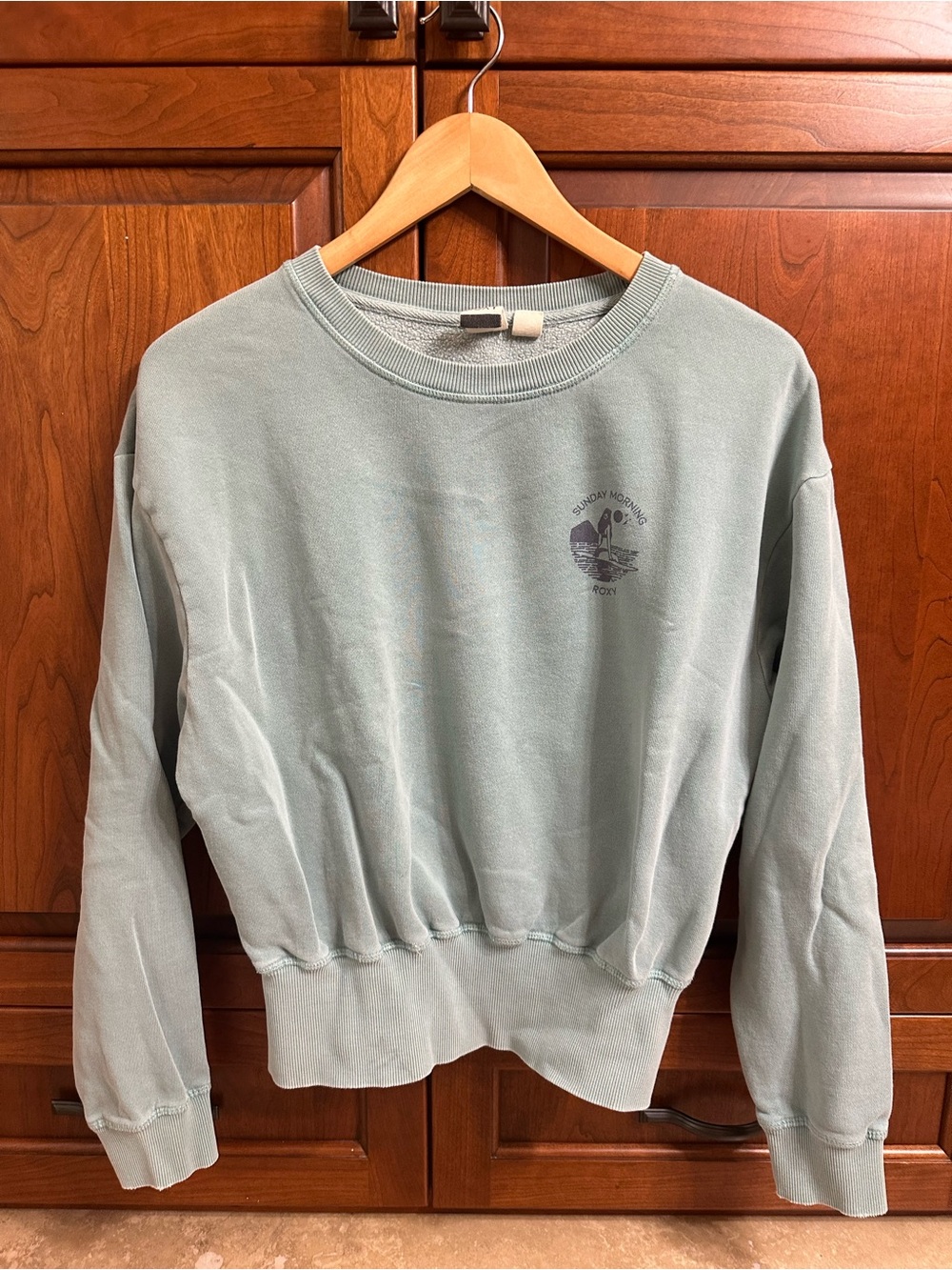 Roxy Seafoam Green Graphic Crop Sweatshirt with gray print